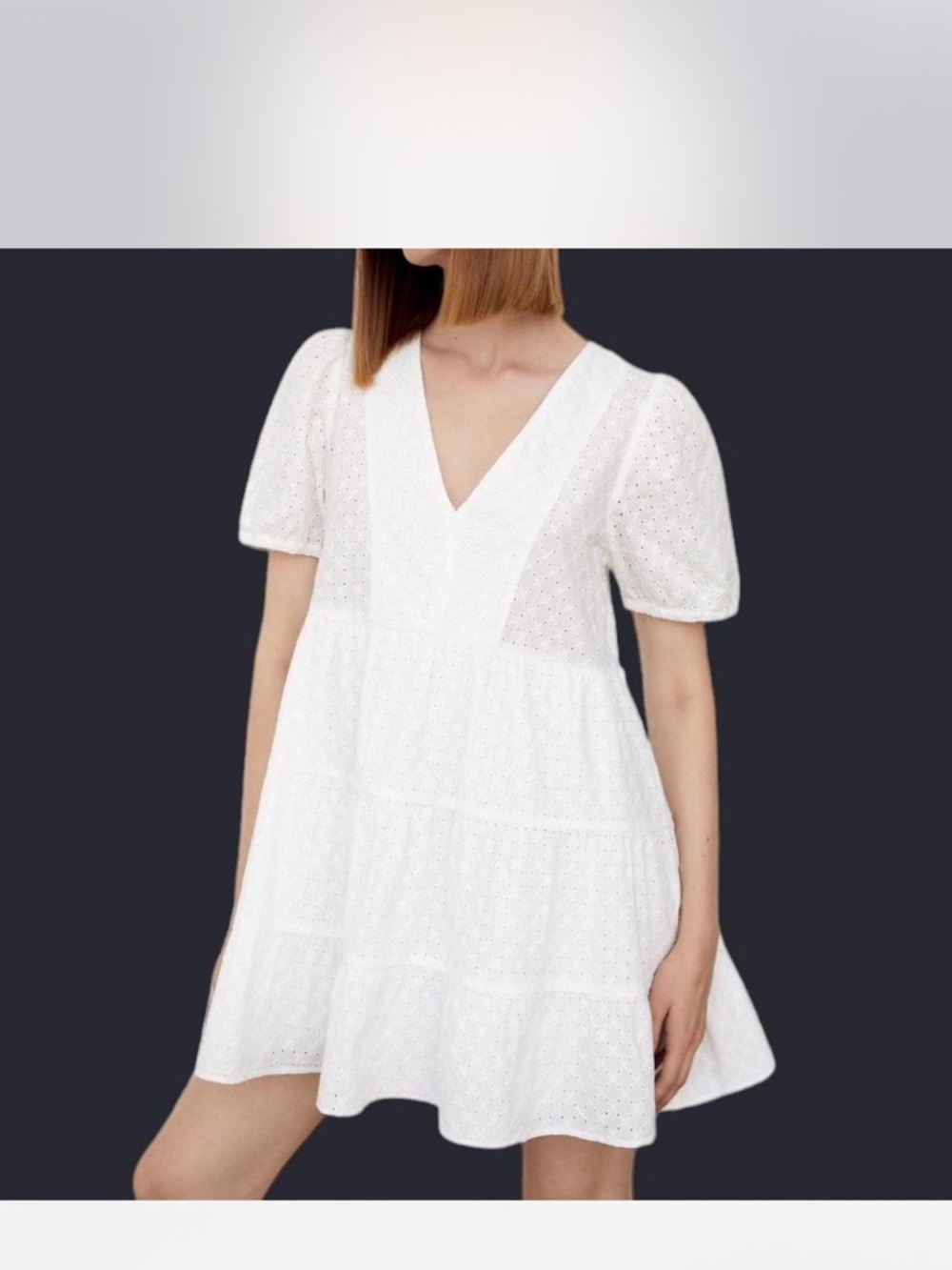 White cotton Zara dress size XS. Puffy sleeves and eyelet fabric design.